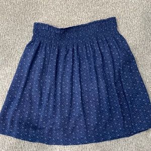 CAbi reversible skirt. Blue w/ lil flowers and red with larger print flowers M